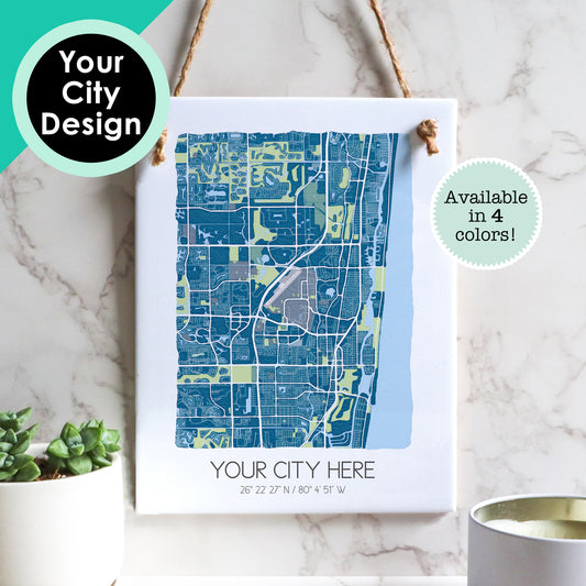 A custom city map of any hometown on a rectangle ceramic tile sign hanging on a wall - Sparks House Co