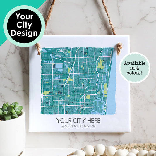 A custom city map of any hometown on a ceramic square tile sign hanging on a wall - Sparks House Co