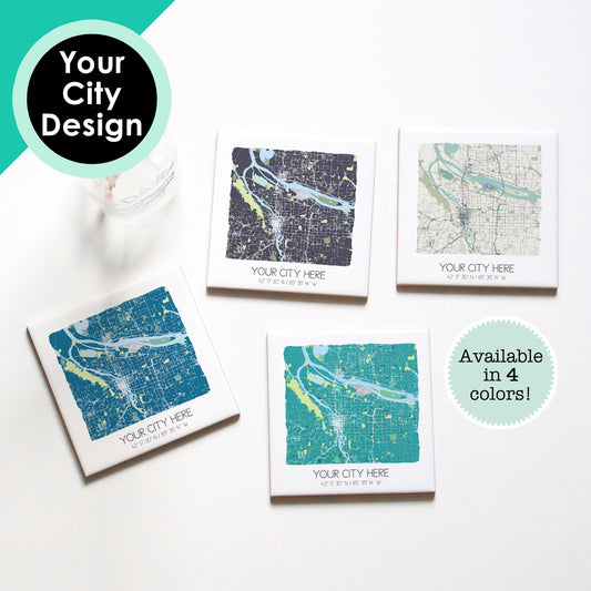 A set of custom city map coasters sitting on a table with a glass, in four different colors - Sparks House Co