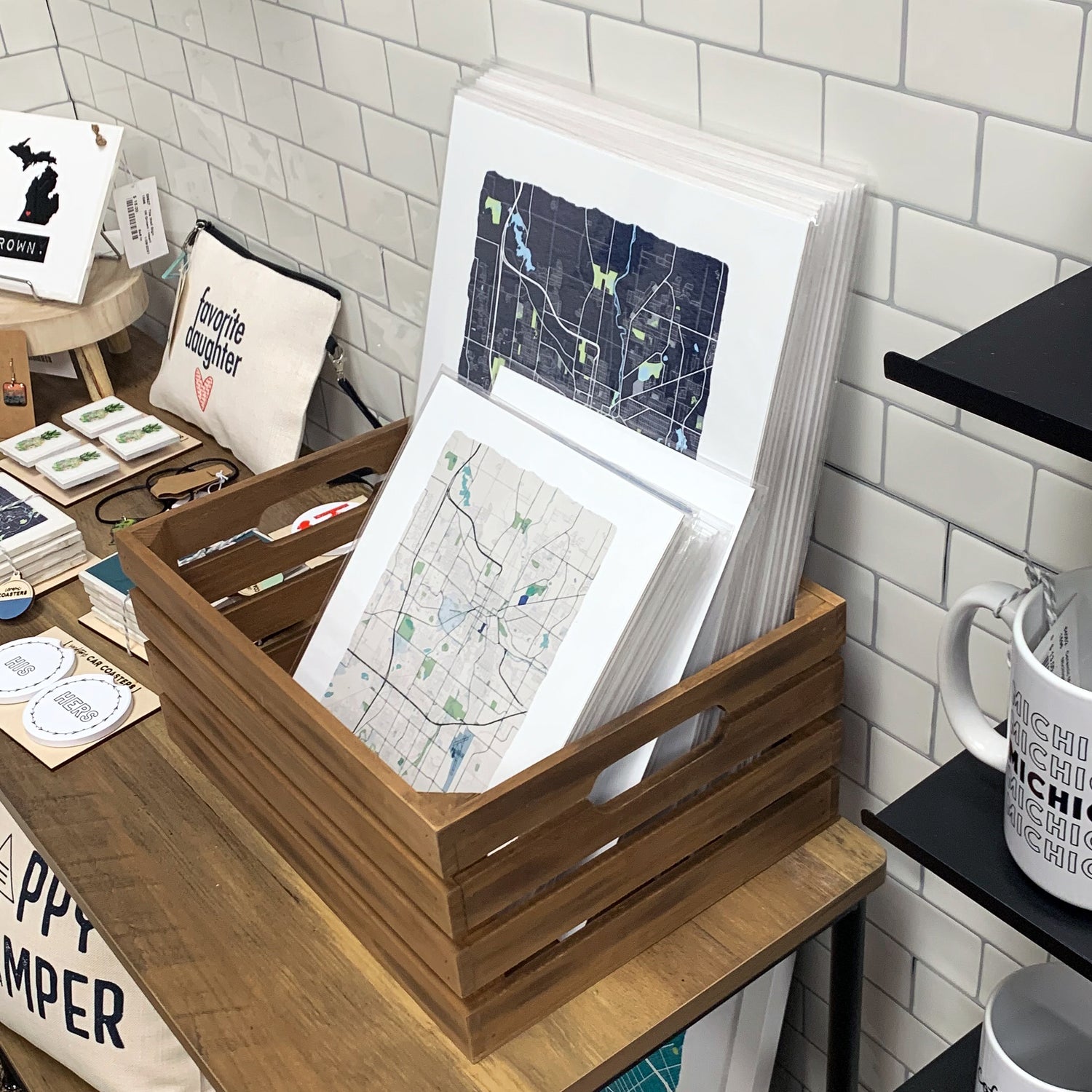 A basket of city map prints sitting on a table in a store