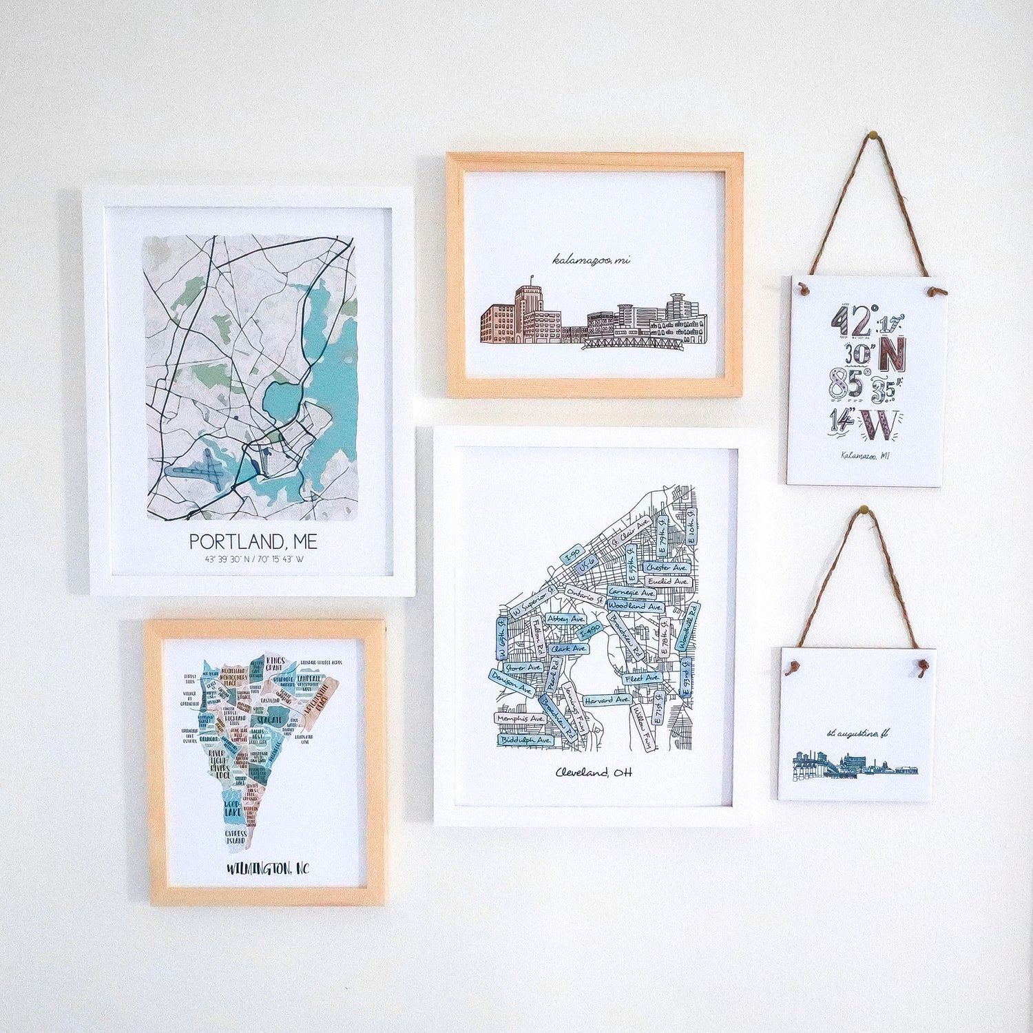 Gallery wall of city maps and street maps and hand drawn maps as prints and tile signs