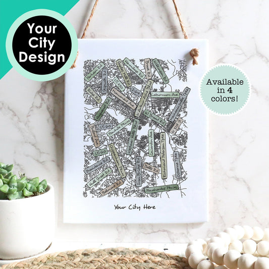 A custom art drawing of a street map of any city, on a rectangle tile sign, hanging on a wall