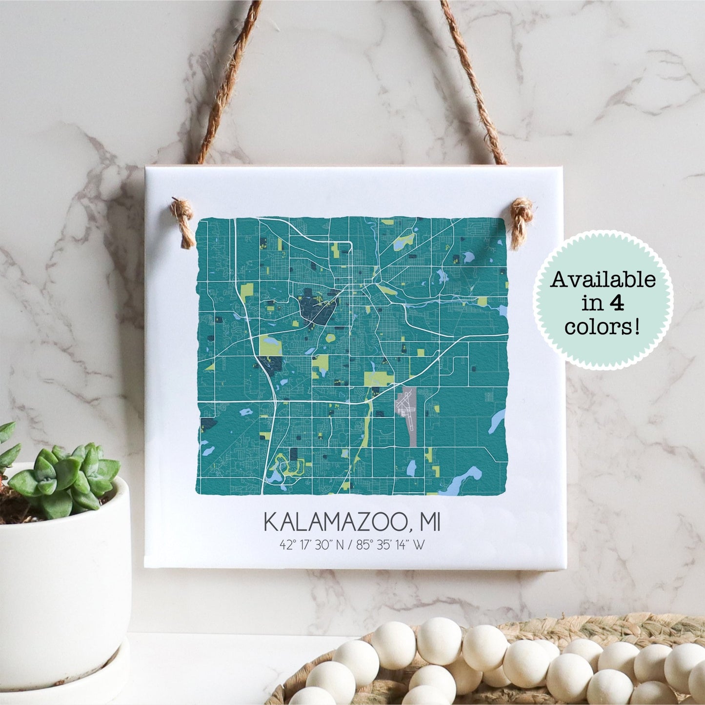 A city map of Kalamazoo Michigan on a square ceramic tile sign hanging on a wall - Sparks House Co