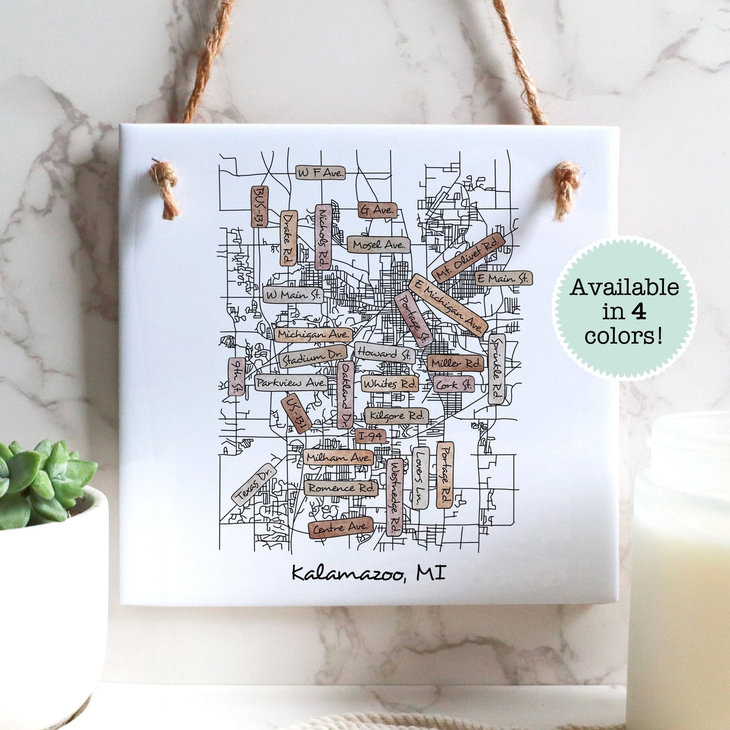 A street map of Kalamazoo Michigan on a ceramic square tile sign hanging on a wall - Sparks House Co